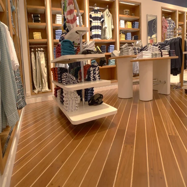 Clothing store with diagonal striped wood flooring