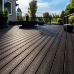 Dark textured composite decking flooring on a spacious balcony