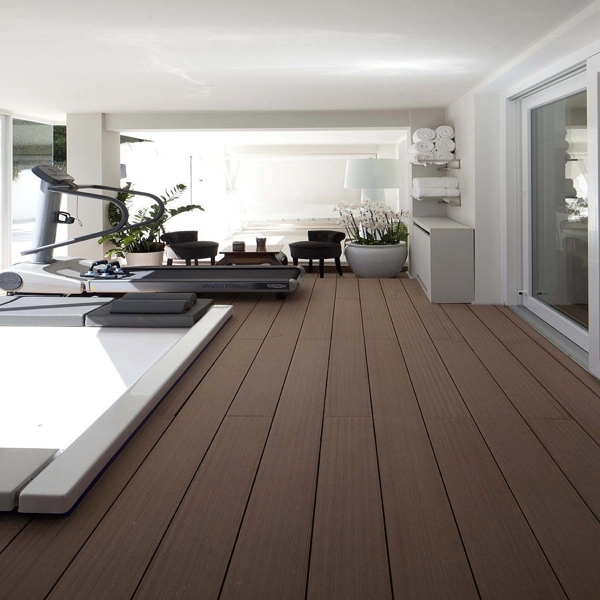 Indoor gym area with long brown composite decking