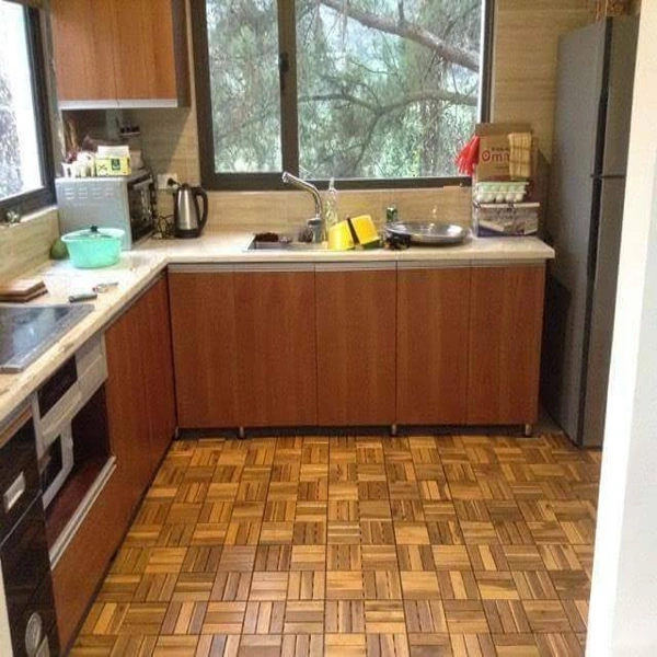 Kitchen with wood parquet tile flooring and oak cabinets